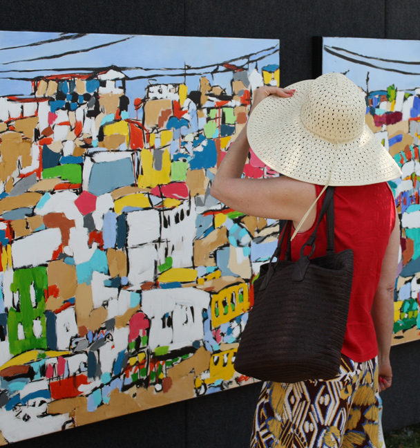 art patron viewing Tijuana Tandum 1 & 2 by Brooke Harker