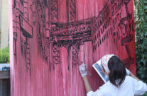 artist Brooke Harker in the process of painting the Manhattan Bridge