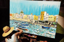artist painting boats in Sicily