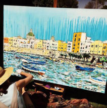 artist painting boats in Sicily