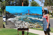 artist Brooke Harker with her finished “Golden Gate Shores”