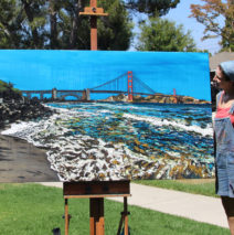 artist Brooke Harker with her finished “Golden Gate Shores”
