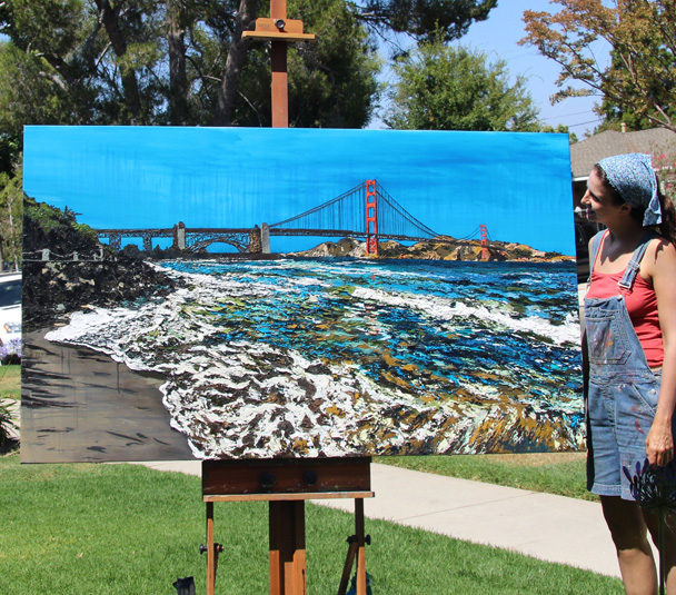 artist Brooke Harker with her finished “Golden Gate Shores”