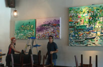 installing paintings at Upper West in Santa Monica
