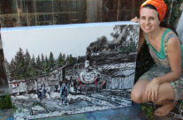 artist Brooke Harker poses with Reflections of Cumbres Pass
