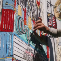 artist painting the Orpheum Theatre in Downtown LA