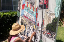 artist painting Broadway in downtown LA by the Orpheum Theatre