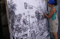 artist Brooke Harker paints the framework of “Boulevard Smile”