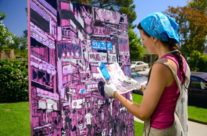 Brooke Harker working on a painting of Hong Kong