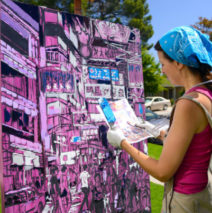 Brooke Harker working on a painting of Hong Kong