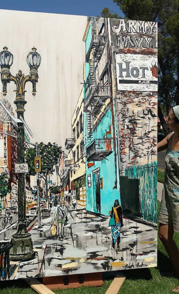 artist Brooke Harker with the finished “Downtown Stride”