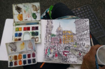 art supplies with a watercolor sketch of Rome, Italy