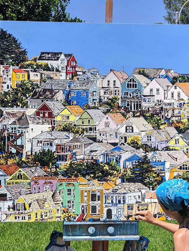 in the final stages of painting “Where Hearts Reside”