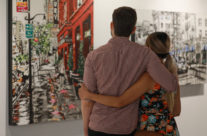 a couple viewing “Hollywood in Stride” by Harker