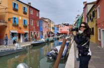 Harker taking photos in Burano, Italy