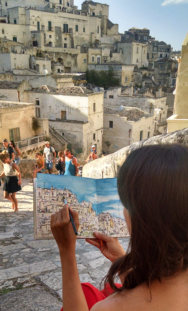 Brooke Harker sketching what inspires “Remembering Matera”