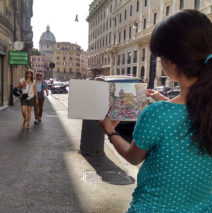Brooke Harker painting the watercolor in Rome that inspired “All Roads Lead”