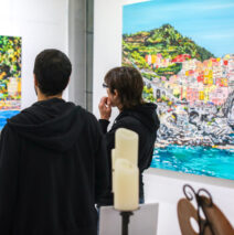 guests looking at “Limoncello Paradise” by Brooke Harker